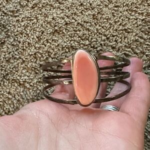 Elegant Gold Bracelet with Peach Stone